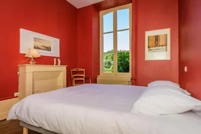 Un ou plusieurs lits dans un hébergement de l'établissement Le petit chateau