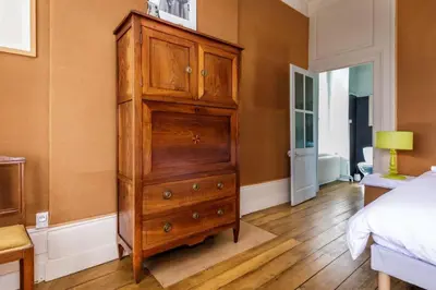 Un ou plusieurs lits dans un hébergement de l'établissement Le petit chateau