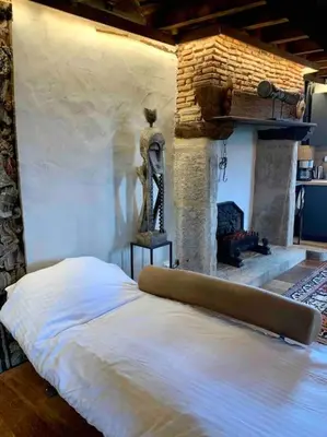 Un ou plusieurs lits dans un hébergement de l'établissement Les Maisons du Bonheur & Balnéo