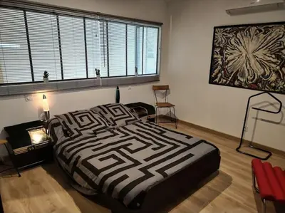 Un ou plusieurs lits dans un hébergement de l'établissement Maison d'Architecte