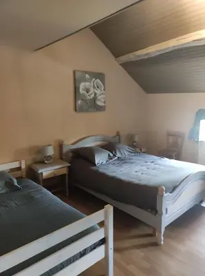 Un ou plusieurs lits dans un hébergement de l'établissement Gite du Dolmen classé 3 épis