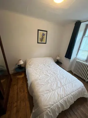 Un ou plusieurs lits dans un hébergement de l'établissement maison de campagne
