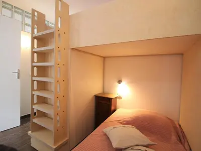 Un ou plusieurs lits dans un hébergement de l'établissement Appartement T2 avec WiFi, proche thermes, 4 pers, Mont-Dore - FR-1-608-252