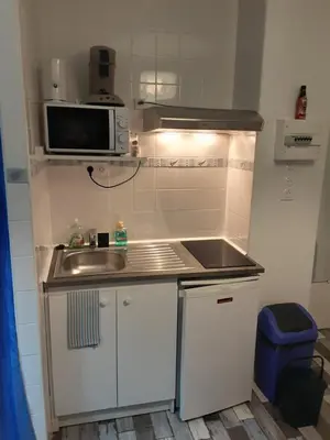 Cuisine ou kitchenette dans l'établissement La Maison du Monde