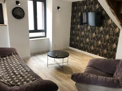 Coin salon dans l'établissement Maison entièrement renovee
