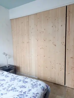 Un ou plusieurs lits dans un hébergement de l'établissement Appartement au rez-de-chaussée