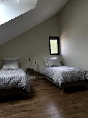 Un ou plusieurs lits dans un hébergement de l'établissement Gîte Bois Tordu - 3 chambres - proche Bourganeuf