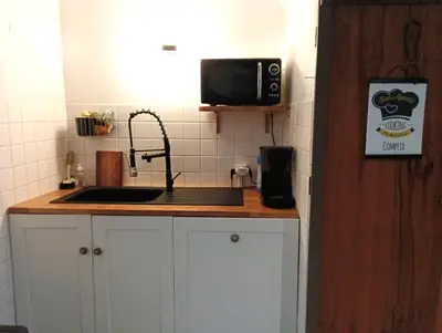 Cuisine ou kitchenette dans l'établissement Cottage reflet de bonheur