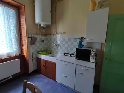 Cuisine ou kitchenette dans l'établissement Le Nid Douillet Bohème Linge fourni
