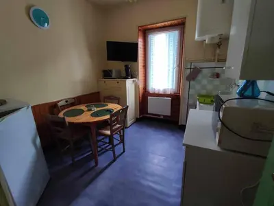 Télévision ou salle de divertissement dans l'établissement Le Nid Douillet Bohème Linge fourni