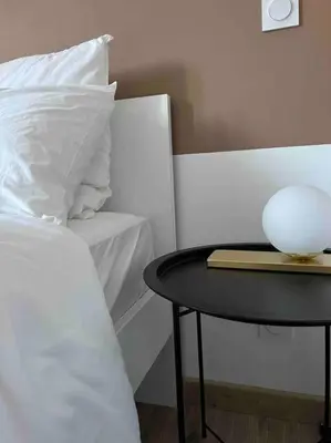 Un ou plusieurs lits dans un hébergement de l'établissement Limoges Sud-LesCinqSuites Le Saint Laurent-DABNB