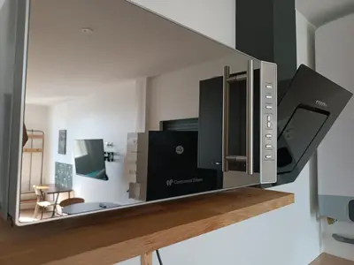 Télévision ou salle de divertissement dans l'établissement Résidence Les Bénédictins