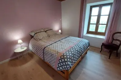 Un ou plusieurs lits dans un hébergement de l'établissement Gîte Chez Mélanie et Léon Séjour nature et animau
