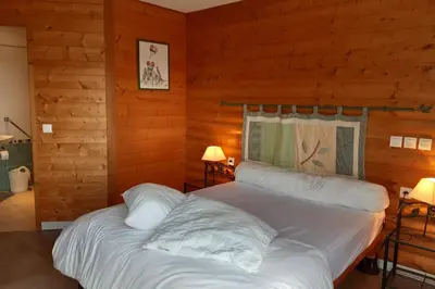 Un ou plusieurs lits dans un hébergement de l'établissement Appartement les Coquelicots Super Besse