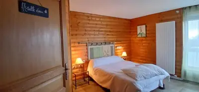 Un ou plusieurs lits dans un hébergement de l'établissement Appartement les Coquelicots Super Besse