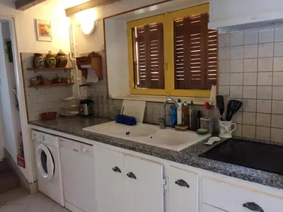 Cuisine ou kitchenette dans l'établissement Maison familiale du pont Millénaire