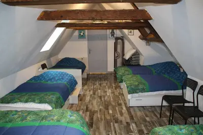 Un ou plusieurs lits dans un hébergement de l'établissement Location maison Bourboule