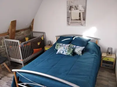 Un ou plusieurs lits dans un hébergement de l'établissement Location maison Bourboule
