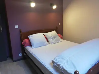 Un ou plusieurs lits dans un hébergement de l'établissement Maison au cœur du Sancy