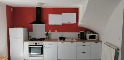 Cuisine ou kitchenette dans l'établissement Maison au cœur du Sancy