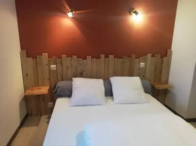 Un ou plusieurs lits dans un hébergement de l'établissement Maison au cœur du Sancy