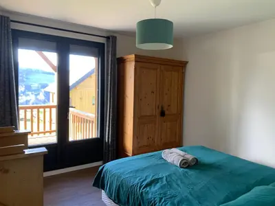 Un ou plusieurs lits dans un hébergement de l'établissement Chalet d'Auvergne - chalet de Perrine