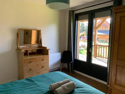 Un ou plusieurs lits dans un hébergement de l'établissement Chalet d'Auvergne - chalet de Perrine