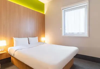 Un ou plusieurs lits dans un hébergement de l'établissement B&B HOTEL Limoges Centre Gare