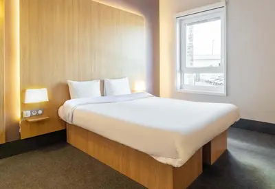 Un ou plusieurs lits dans un hébergement de l'établissement B&B HOTEL Limoges Centre Gare