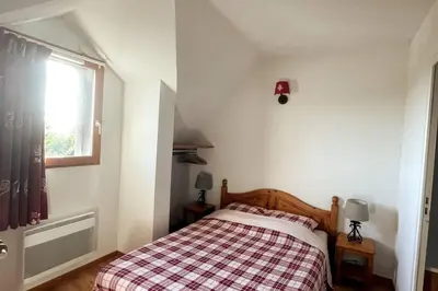 Un ou plusieurs lits dans un hébergement de l'établissement T3 duplex Super Besse, parking, piscine, wifi