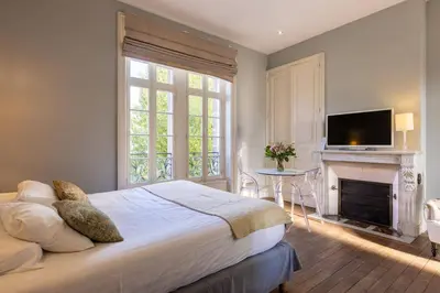 Un ou plusieurs lits dans un hébergement de l'établissement La Villa Beaupeyrat