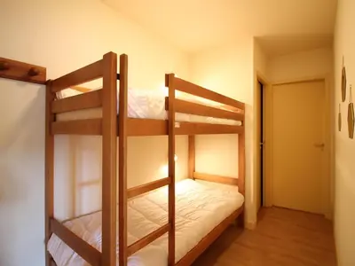 Un ou plusieurs lits dans un hébergement de l'établissement Appartement T2 bis à La Bourboule, animaux admis, parking, Wifi - FR-1-608-254