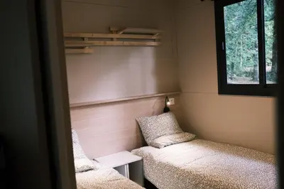 Un ou plusieurs lits dans un hébergement de l'établissement Lodge avec SPA privatif - Foret et Lac