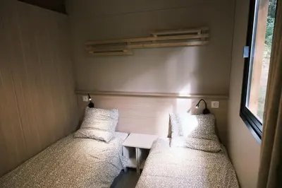 Un ou plusieurs lits dans un hébergement de l'établissement Lodge avec SPA privatif - Foret et Lac