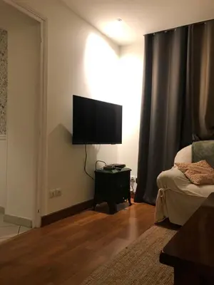 Télévision ou salle de divertissement dans l'établissement Le gîte de l’horloge