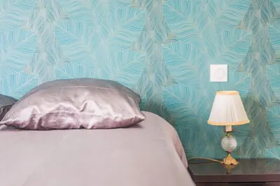 Un ou plusieurs lits dans un hébergement de l'établissement Les Rosiers - Maison avec JACUZZI