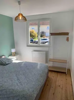 Un ou plusieurs lits dans un hébergement de l'établissement Maison familiale 80m2 3 chambres