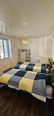 Un ou plusieurs lits dans un hébergement de l'établissement Maison de village