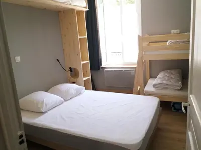 Un ou plusieurs lits dans un hébergement de l'établissement Appart résidence Le Dordogne