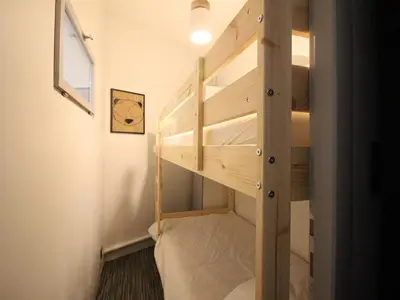 Un ou plusieurs lits superposés dans un hébergement de l'établissement Appartement 8 pers, centre Mont-Dore, WIFI - FR-1-608-256