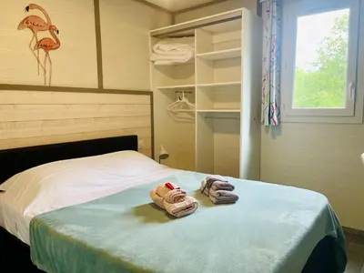 Un ou plusieurs lits dans un hébergement de l'établissement Le Village Enchanteur