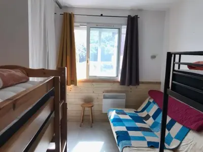 Un ou plusieurs lits dans un hébergement de l'établissement appartement 6 places station super besse