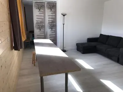 Coin salon dans l'établissement appartement 6 places station super besse