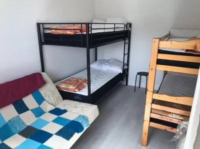 Un ou plusieurs lits dans un hébergement de l'établissement appartement 6 places station super besse