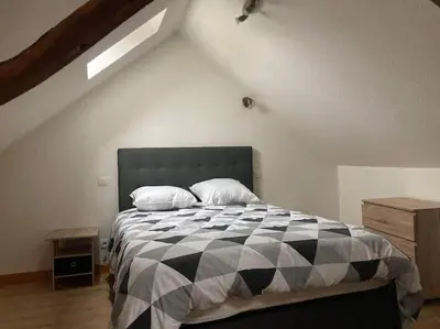 Un ou plusieurs lits dans un hébergement de l'établissement Gite au cœur du village du Périgord noir