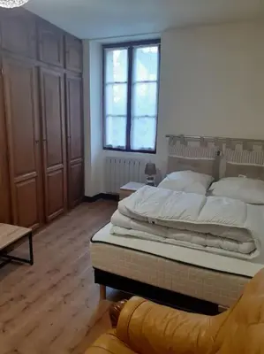 Un ou plusieurs lits dans un hébergement de l'établissement Gite au cœur du village du Périgord noir