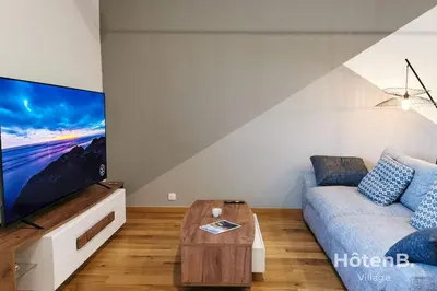 Télévision ou salle de divertissement dans l'établissement Spacious Cocoon with AC and PARKING At the Heart of Feytiat Limoges