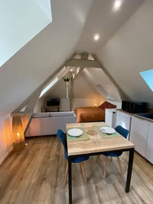 Coin salon dans l'établissement Appartement chaleureux - Clim réversible - Meublé A-Z