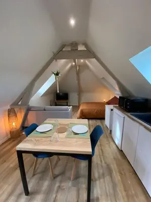 Coin salon dans l'établissement Appartement chaleureux - Clim réversible - Meublé A-Z