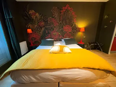 Un ou plusieurs lits dans un hébergement de l'établissement VILLA FLEURY - APPART'HÔTEL DE STANDING